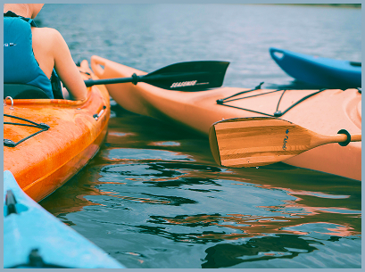 two people paddling in canoes